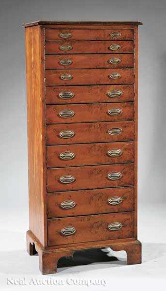 Appraisal: An English Yew Wood Chest molded top over eleven graduated