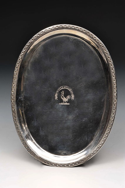 Appraisal: A GEORGE III SILVER OVAL TEAPOT STAND with engraved guilloche