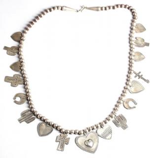 Appraisal: Don Lucas Sterling Charm Necklace The sterling silver beaded necklace