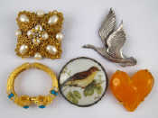 Appraisal: A mixed lot comprising three costume jewellery brooches and a