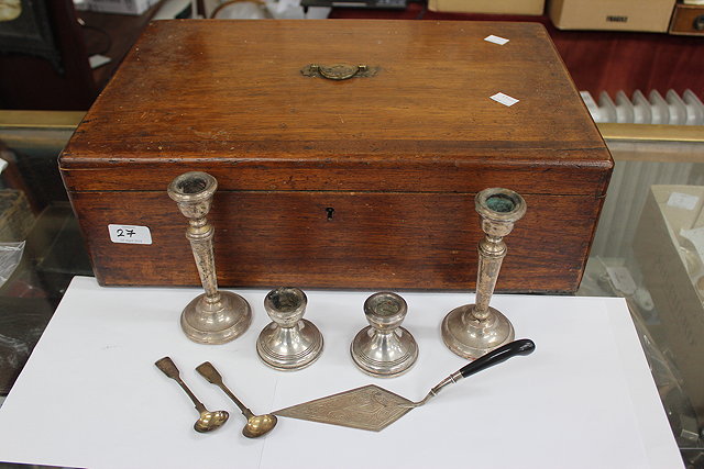 Appraisal: TWO PAIRS OF SMALL LOADED SILVER CANDLESTICKS together with two