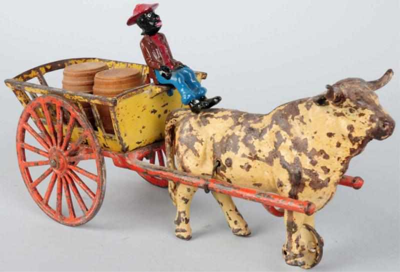 Appraisal: Cast Iron Ox-Drawn Cart Toy American Pulled by one ox