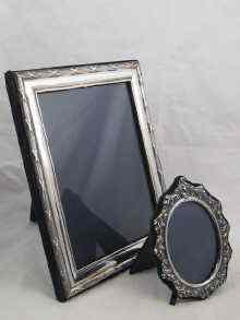 Appraisal: Two silver photograph frames one with ribbon and reed decoration