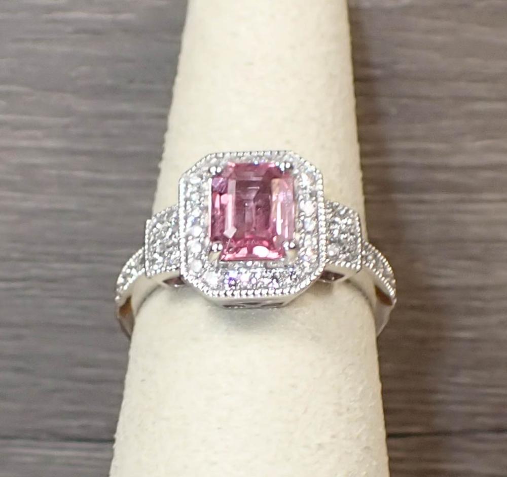 Appraisal: PINK SAPPHIRE DIAMOND AND PLATINUM RING with round full-cut diamonds