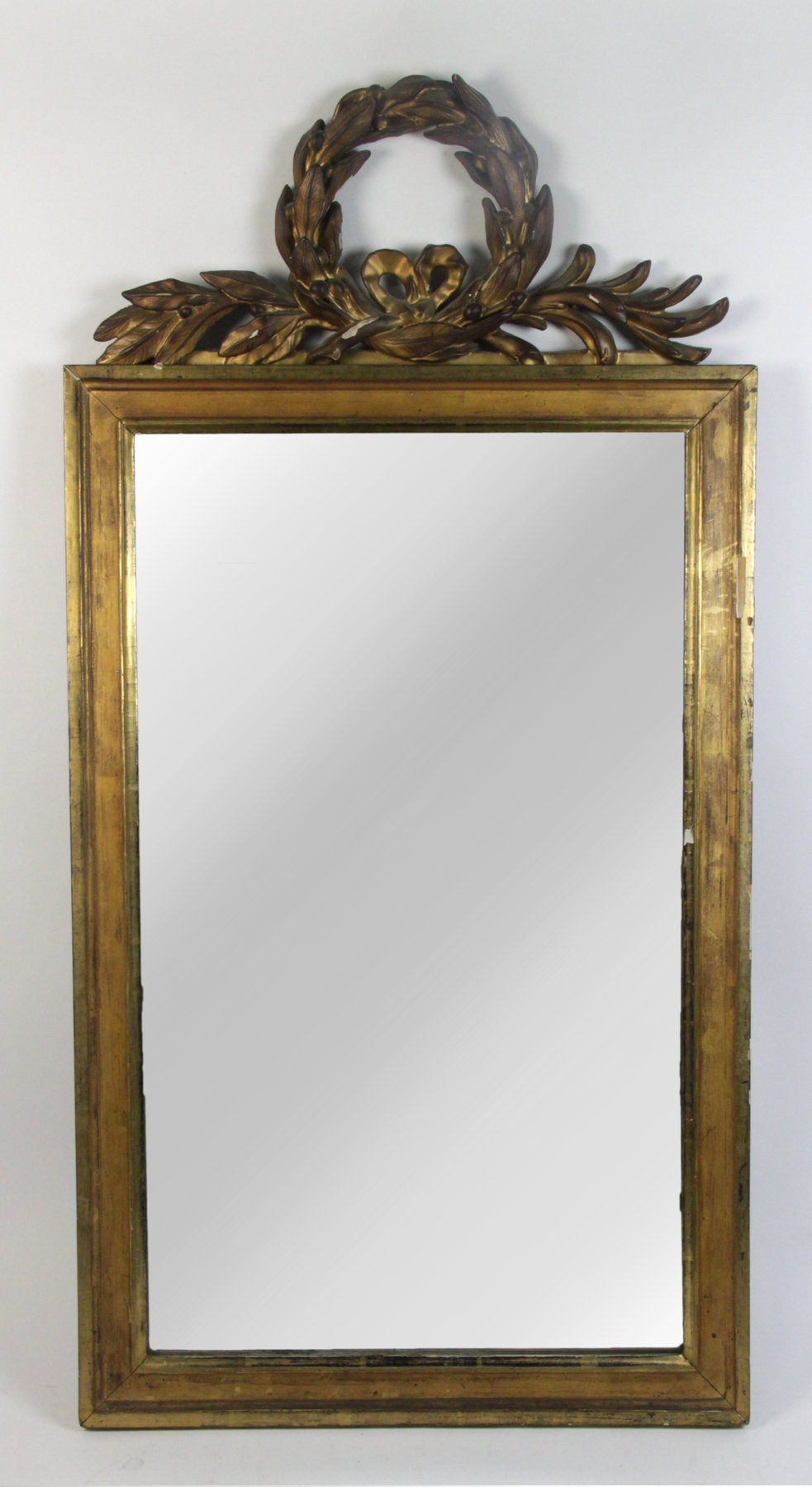 Appraisal: A gilt mirror with laurel wreath cresting cm high