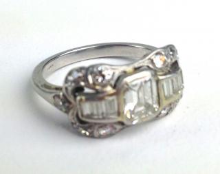 Appraisal: Ca platinum ladies diamond ring having stepped baguette center diamond