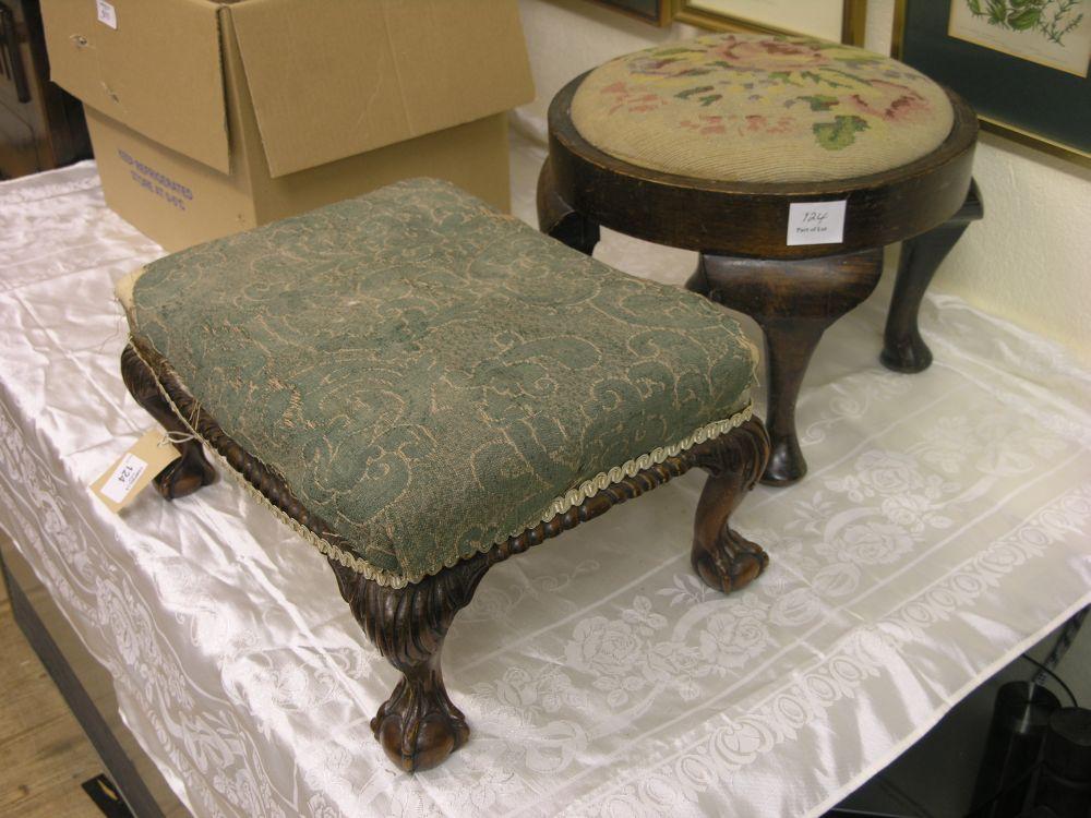 Appraisal: A mahogany framed upholstered footstool on carved claw and ball