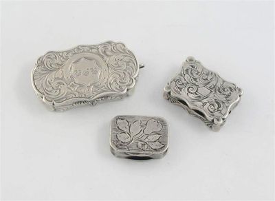 Appraisal: Three vinaigrettes a Victorian scroll-engraved example with rounded ends by