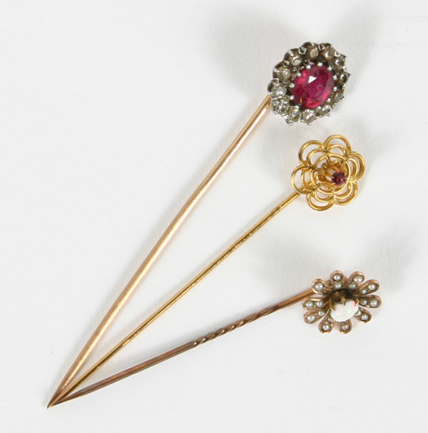 Appraisal: Lot of three Victorian stick pins in gold mounts including