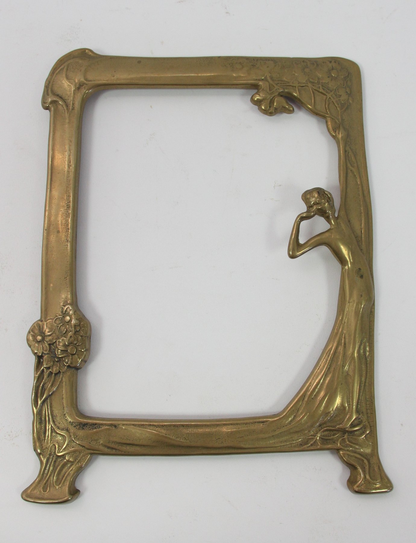 Appraisal: A brass frame of Art Nouveau design with female figure