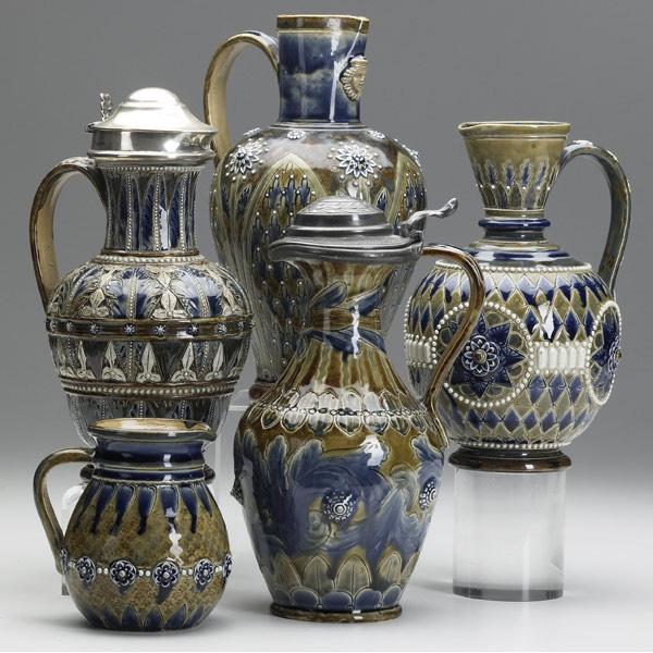 Appraisal: DOULTON Lambeth Five stoneware pitchers decorated in the Aesthetic Movement