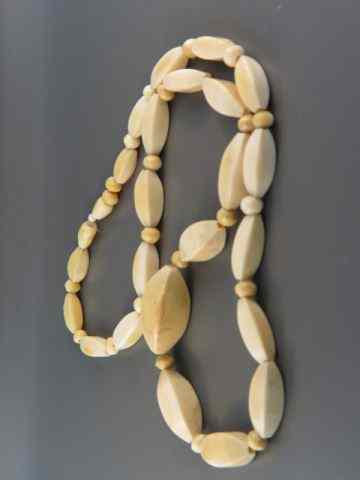 Appraisal: Ivory Necklace oblong round beads '' long