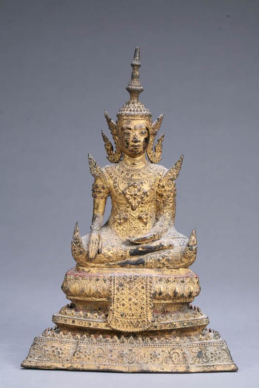 Appraisal: STATUE OF A SEATED DEITY Indonesian th century brass or