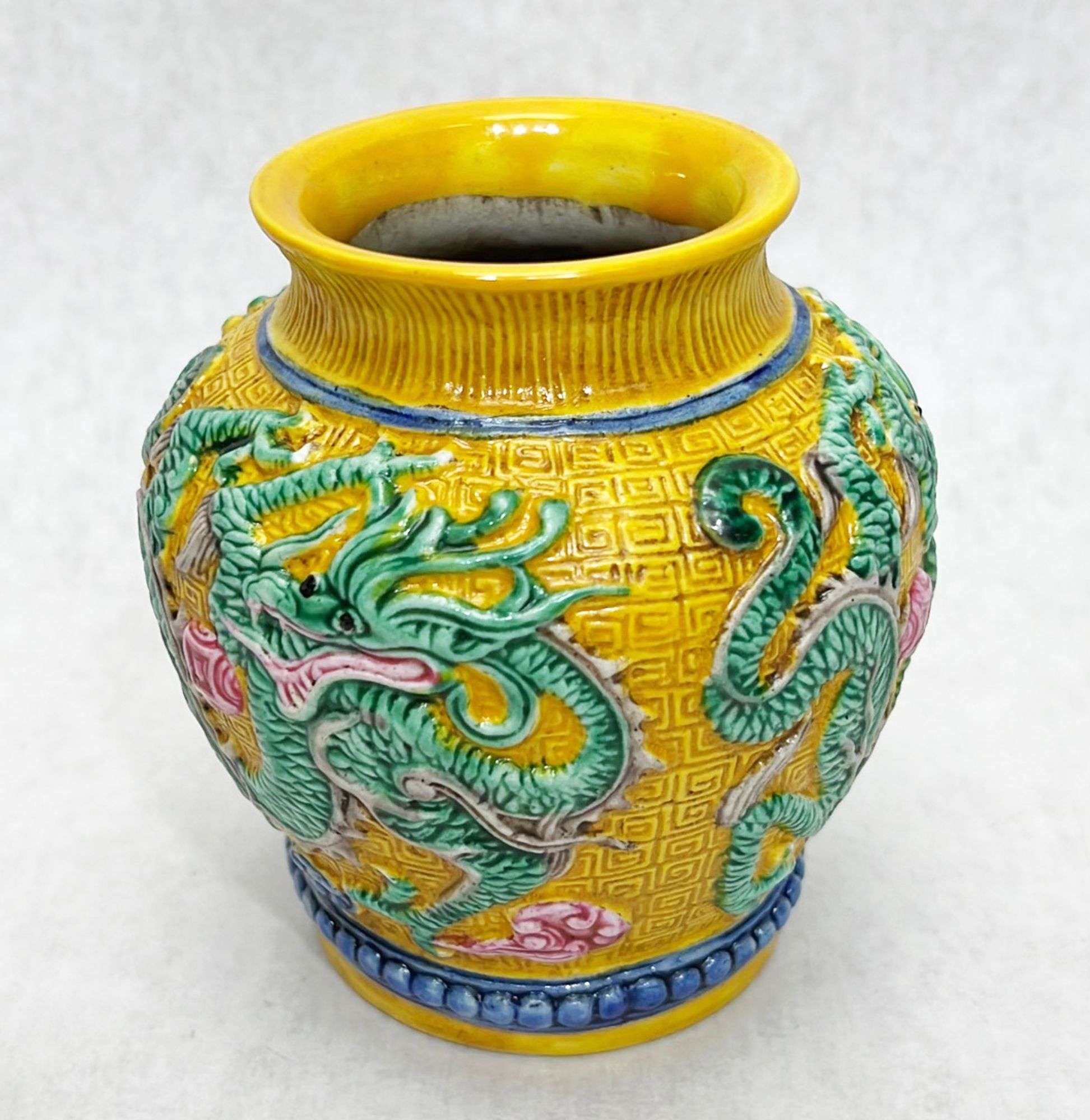 Appraisal: Chinese porcelain dragon vase character mark to underside Stands in