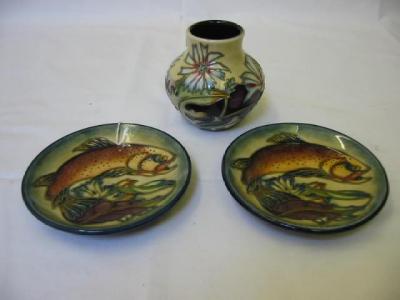 Appraisal: A PAIR OF WALTER MOORCROFT DISHES of circular form painted