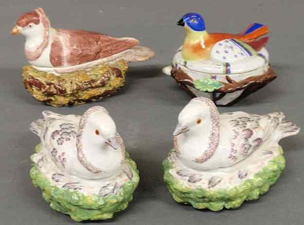 Appraisal: Two similar th c Staffordshire pigeons-on-nests x and two other