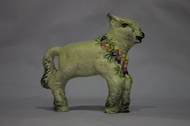 Appraisal: A CLARICE CLIFF MODEL OF A SPRING LAMB with a