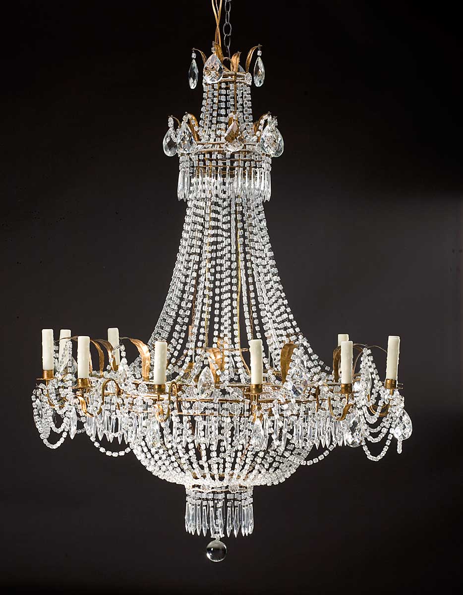 Appraisal: LOUIS XVI STYLE CUT-GLASS TWELVE-LIGHT CHANDELIER The corona hung with