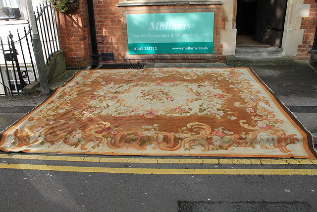 Appraisal: AN ANTIQUE AUBUSSON CARPET with central traditional foliate design within