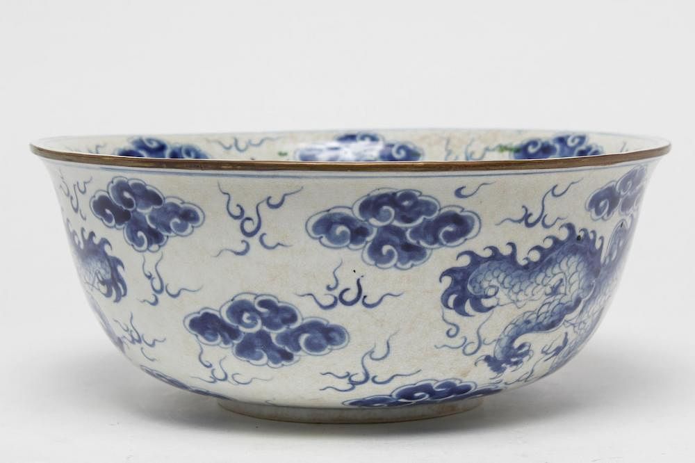 Appraisal: Chinese Blue White Porcelain Dragon Punch Bowl Chinese blue- and