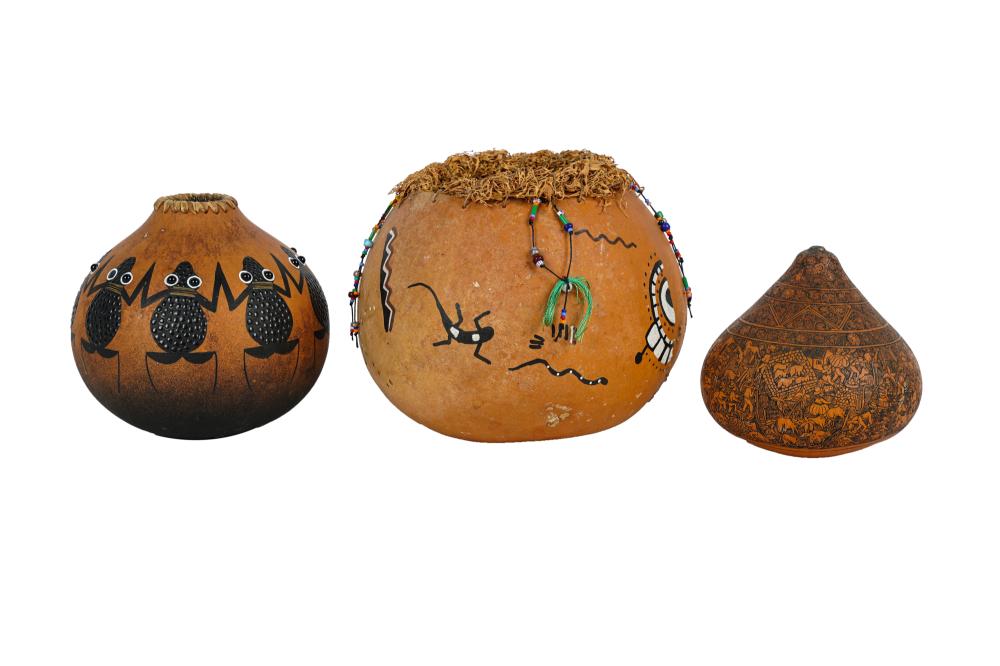 Appraisal: THREE NATIVE AMERICAN PAINTED GOURDScomprising a Linda Aguilar gourd and