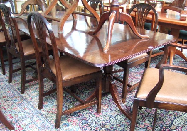 Appraisal: A Regency style mahogany twin pedestal dining table on reeded