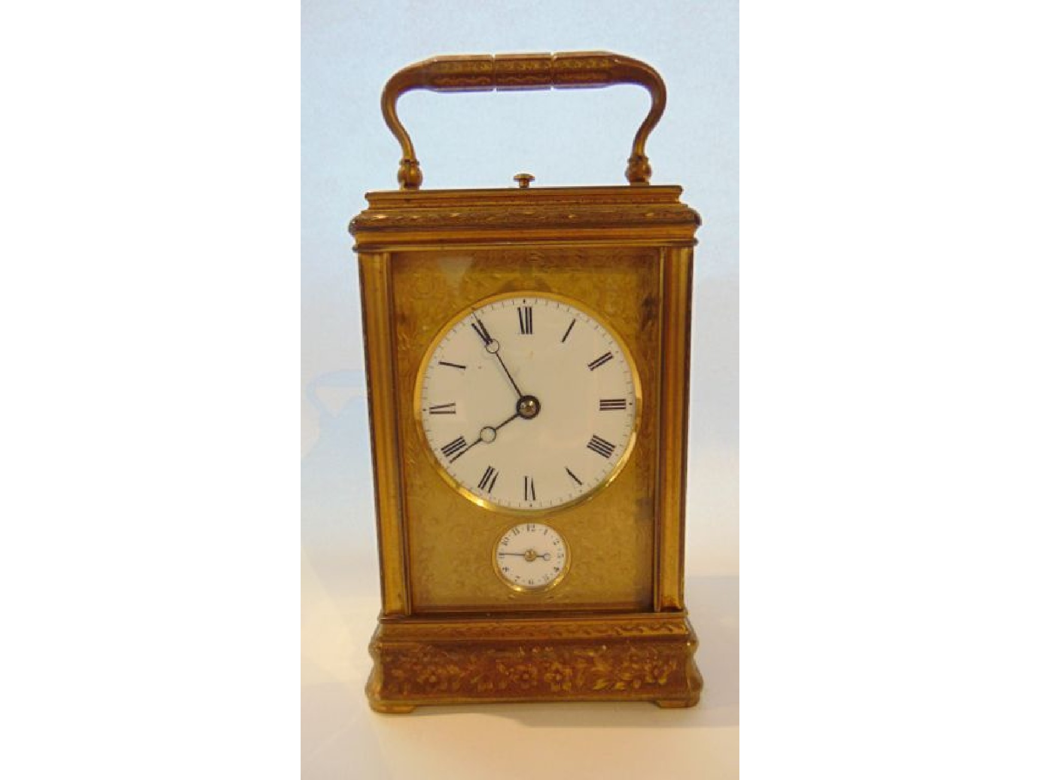 Appraisal: A French engraved gilt brass carriage clock with fully engraved