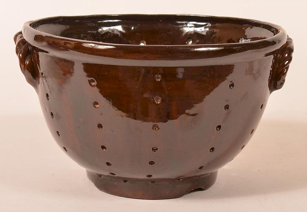 Appraisal: Breininger Glazed Redware Colander Early Breininger Pottery Mottle Glazed Redware