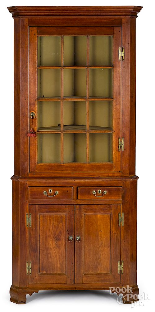 Appraisal: Diminutive Pennsylvania two-part corner cupboard Diminutive Pennsylvania walnut two-part corner