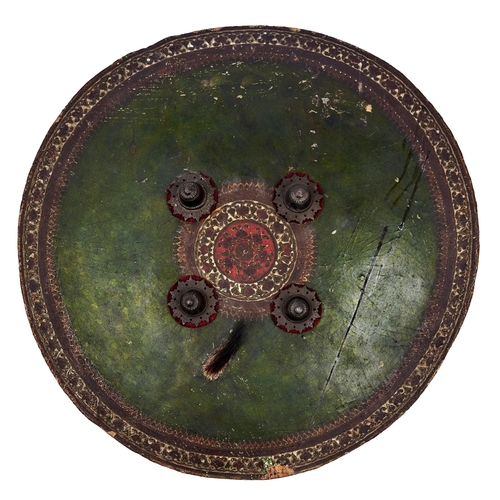 Appraisal: An Indian lacquered hide shield dhal th c of slightly