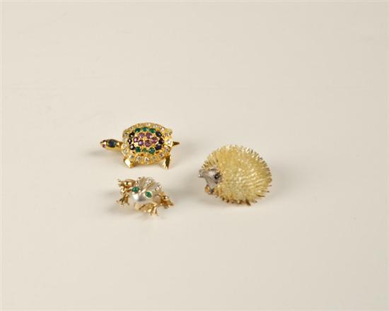 Appraisal: Three Small Animal Brooches a hedgehog with blue stone eyes