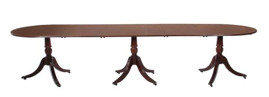 Appraisal: Sheraton style inlaid mahogany triple-pedestal dining table crossbanded top with