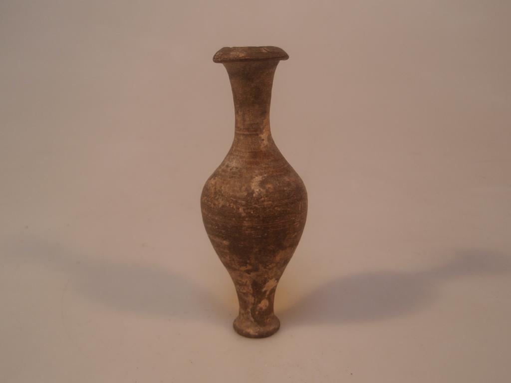 Appraisal: A Hellenistic small pottery grey spindle-shaped bottle decorated with a