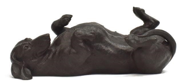 Appraisal: Cast resin sculpture in a bronze patina Rolling Dachshund signed