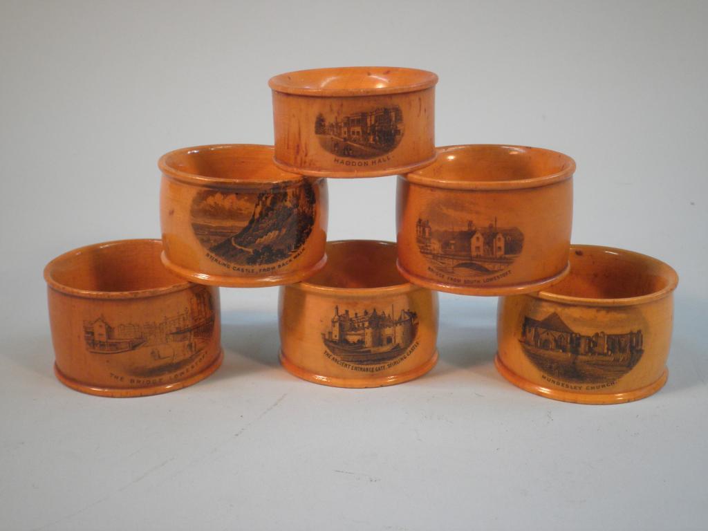 Appraisal: Six Mauchlineware sycamore napkin rings some stamped bought in the