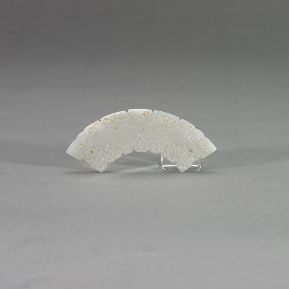 Appraisal: White Jade Curved Pendant With archaistic mask design no condition