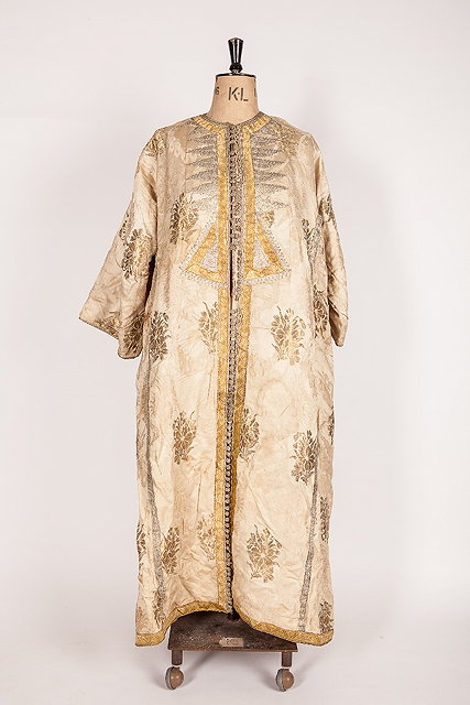 Appraisal: AN EUROPEAN SILK COAT with gold and silver thread ornament