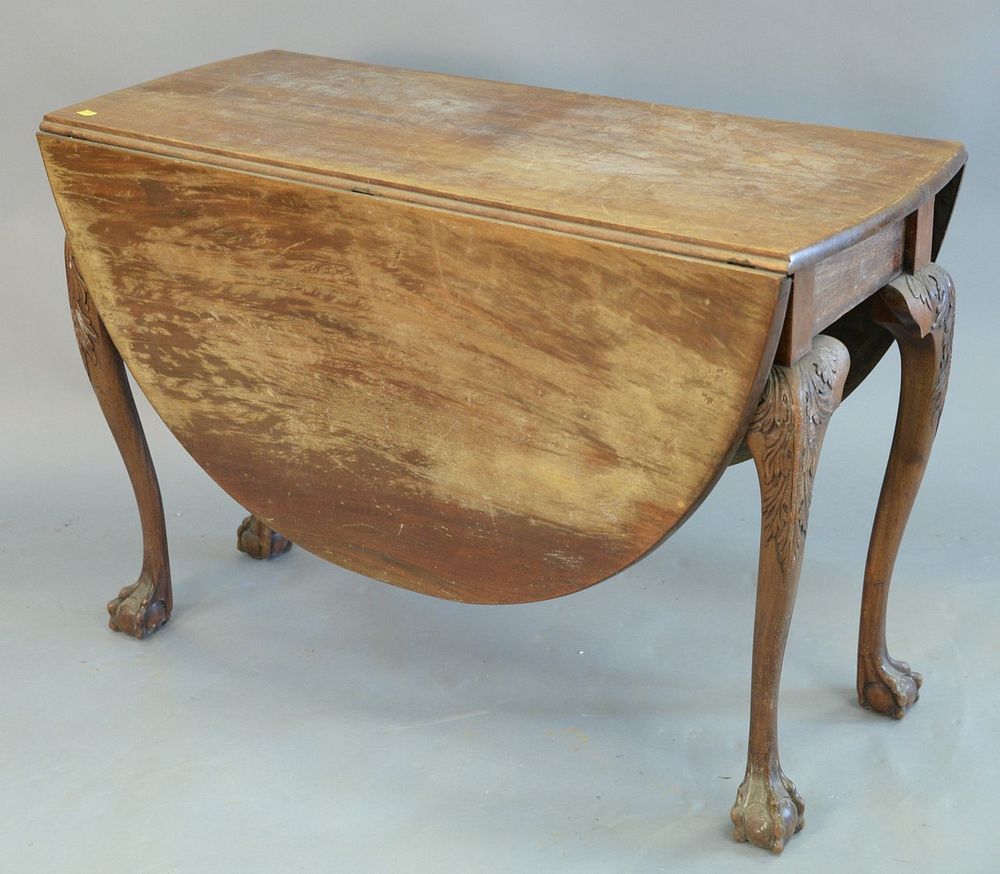 Appraisal: George II mahogany drop leaf table with craved knees and