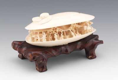 Appraisal: A Carved Ivory Anabori Netsuke Shell In the shape of