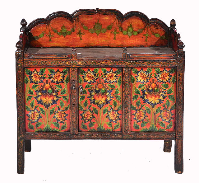 Appraisal: A TIBETAN PAINTED LOW CABINET with shaped galleried top and