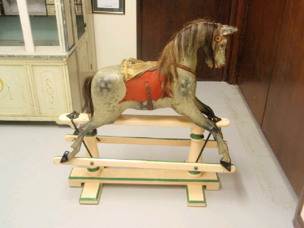 Appraisal: A Victorian painted wooden rocking horse in dapple grey cm