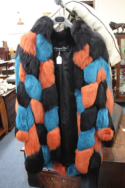 Appraisal: A CHRISTIAN DIOR BLUE ORANGE AND BLACK FUR COAT