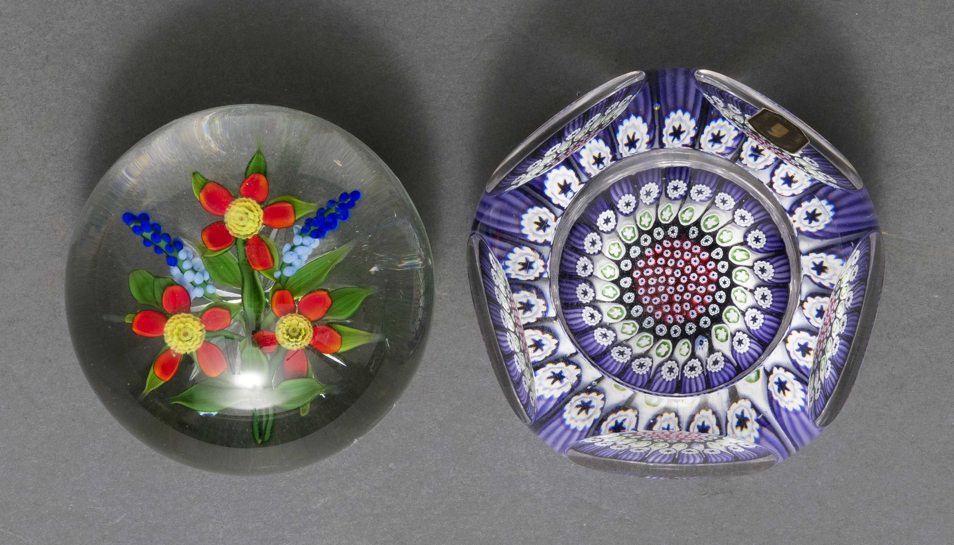 Appraisal: TWO GLASS PAPERWEIGHTS th CenturyOne faceted millefiori dated on interior