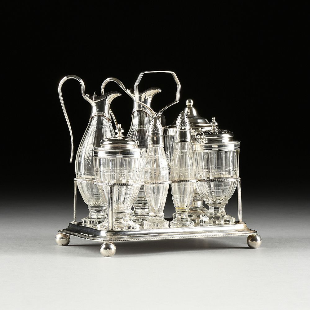 Appraisal: A GEORGE III SILVER CRUET STAND AND SEVEN ASSOCIATED SILVER