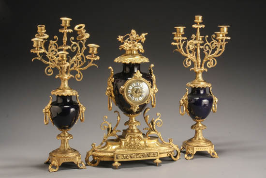 Appraisal: Louis XVI Style Ormolu and Cobalt-Blue Porcelain Three-Piece Clock Garniture