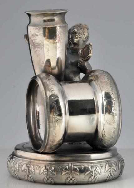 Appraisal: Draped Cherub Figural Napkin Ring With mirror by silver-plated bud