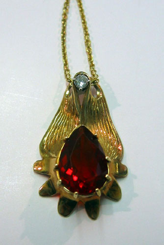 Appraisal: FIRE OPAL DIAMOND AND FOURTEEN KARAT GOLD PENDANT NECKLACE The