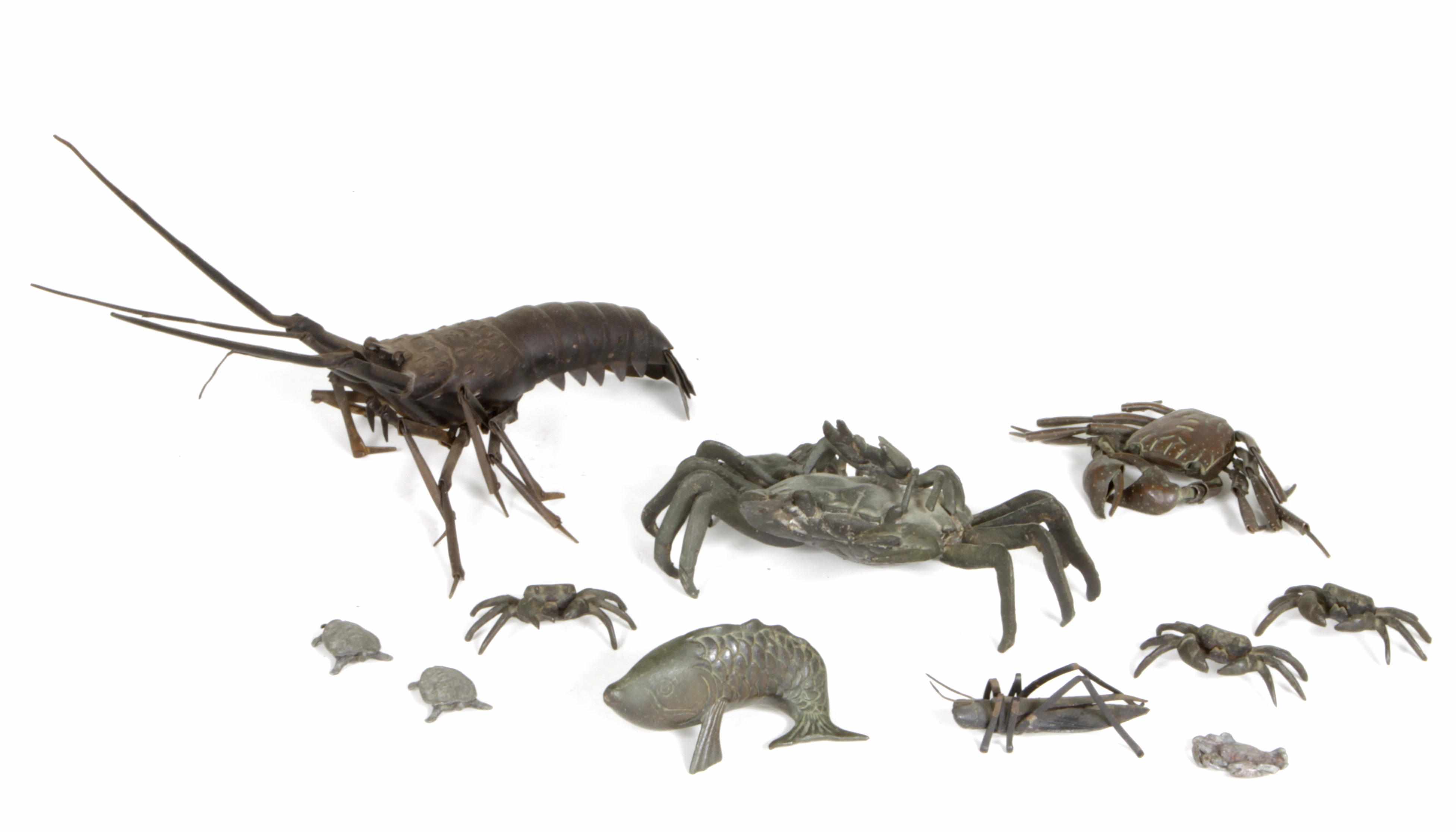 Appraisal: A group of twelve Japanese patinated metal animal form figures