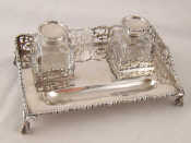 Appraisal: A late Victorian silver two bottle ink stand on claw