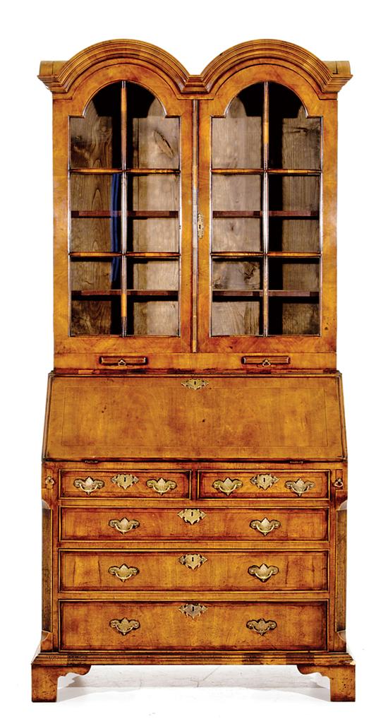 Appraisal: George II style walnut bureau bookcase molded double-domed cornice over